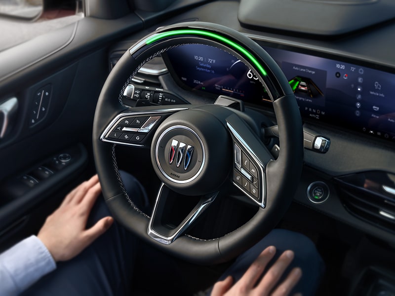 A person using the Super Cruise technology while driving inside the 2025 Buick Enclave ST.