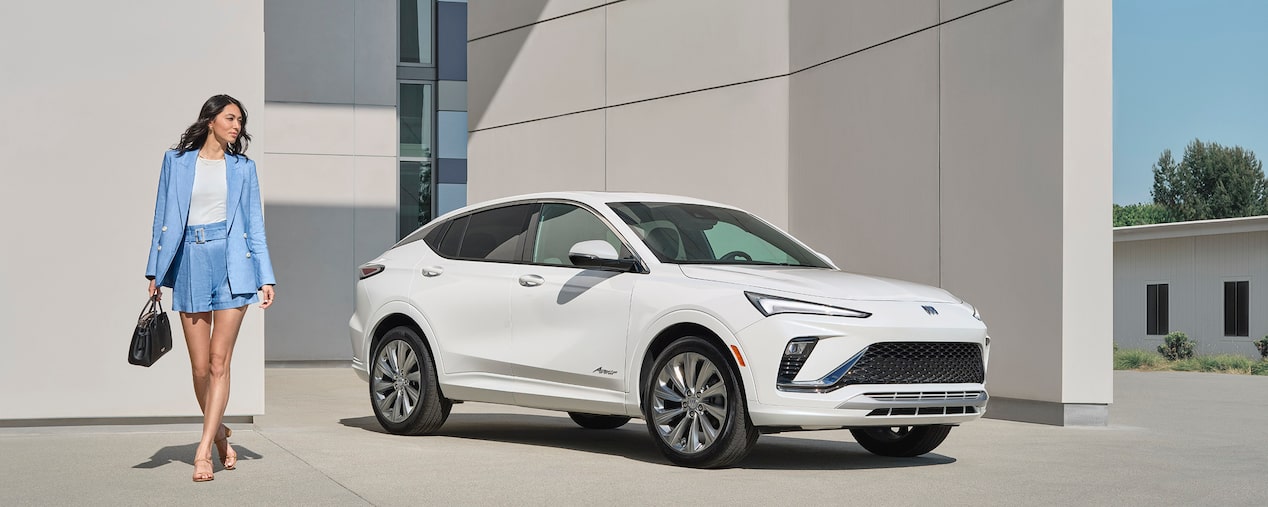 The 2024 Buick Envista Avenir parked on the side of a building.