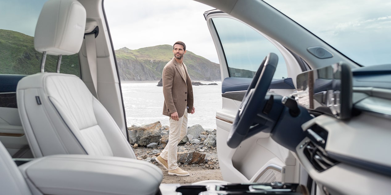 2025 Buick Enclave Avenir interior featuring the driver seat and steering wheel.