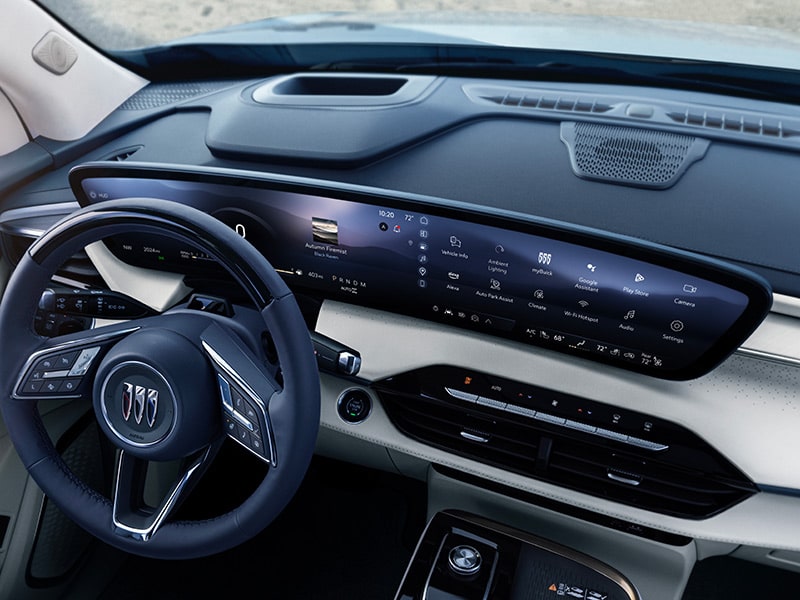 2025 Buick Enclave Avenir featuring the steering wheel and infotainment system.