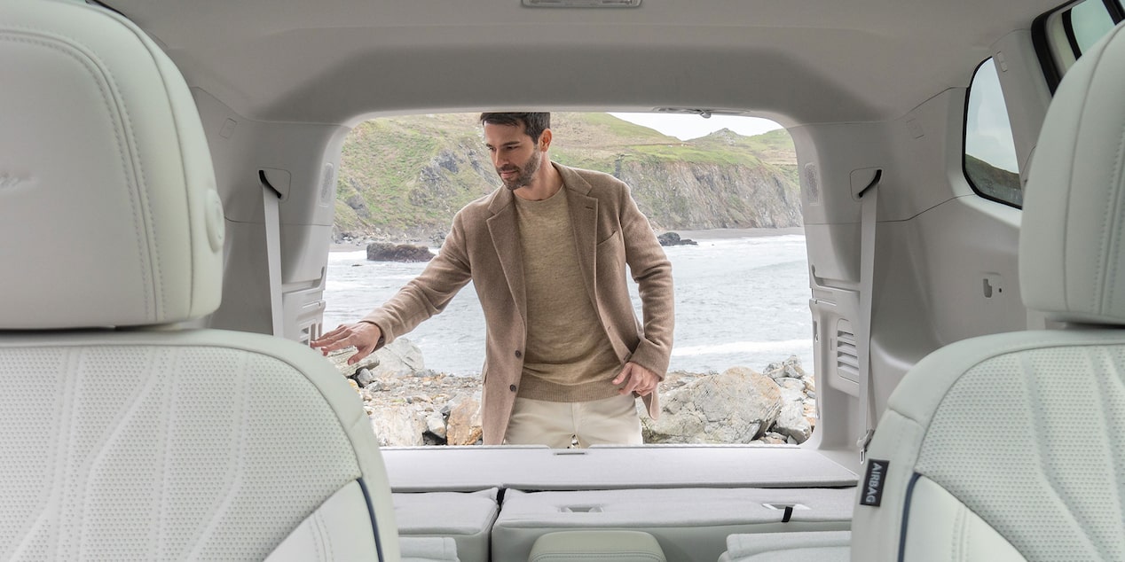 A person utilizing the liftgate feature of the 2025 Buick Enclave.