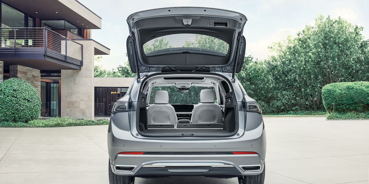 Back View of the 2025 Buick Envision Avenir Compact Luxury SUV with its Trunk Open.