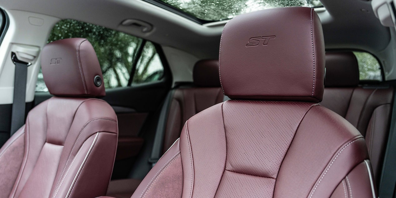 Close-up of the "ST" Stitching on the Seat Headrest in a 2025 Buick Envision ST Sporty Compact SUV.