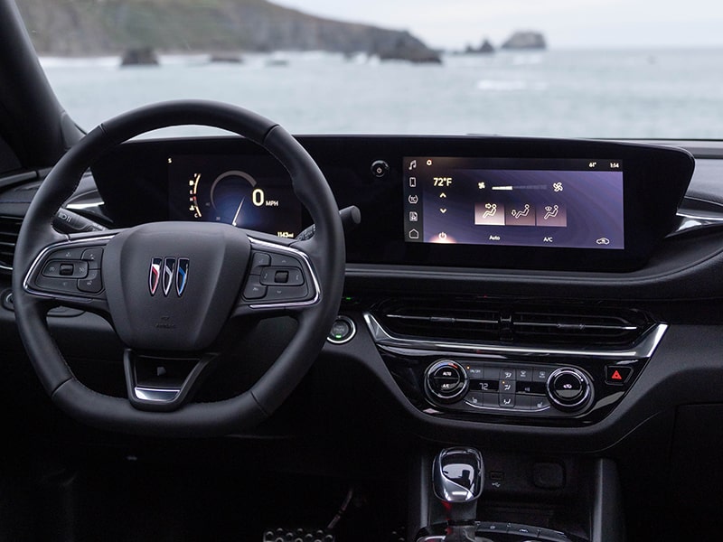 The 2025 Buick Envista interior featuring the infotainment and steering wheel.