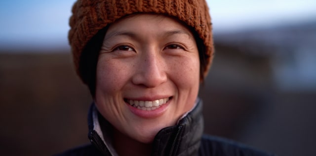 A person smiling eligible for GM's Welcome to Canada Program.