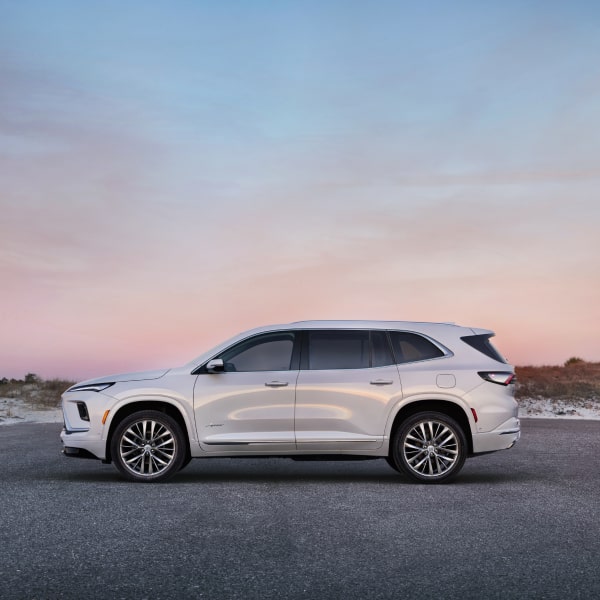 Side view of the 2025 Buick Enclave parked alone during sundown.