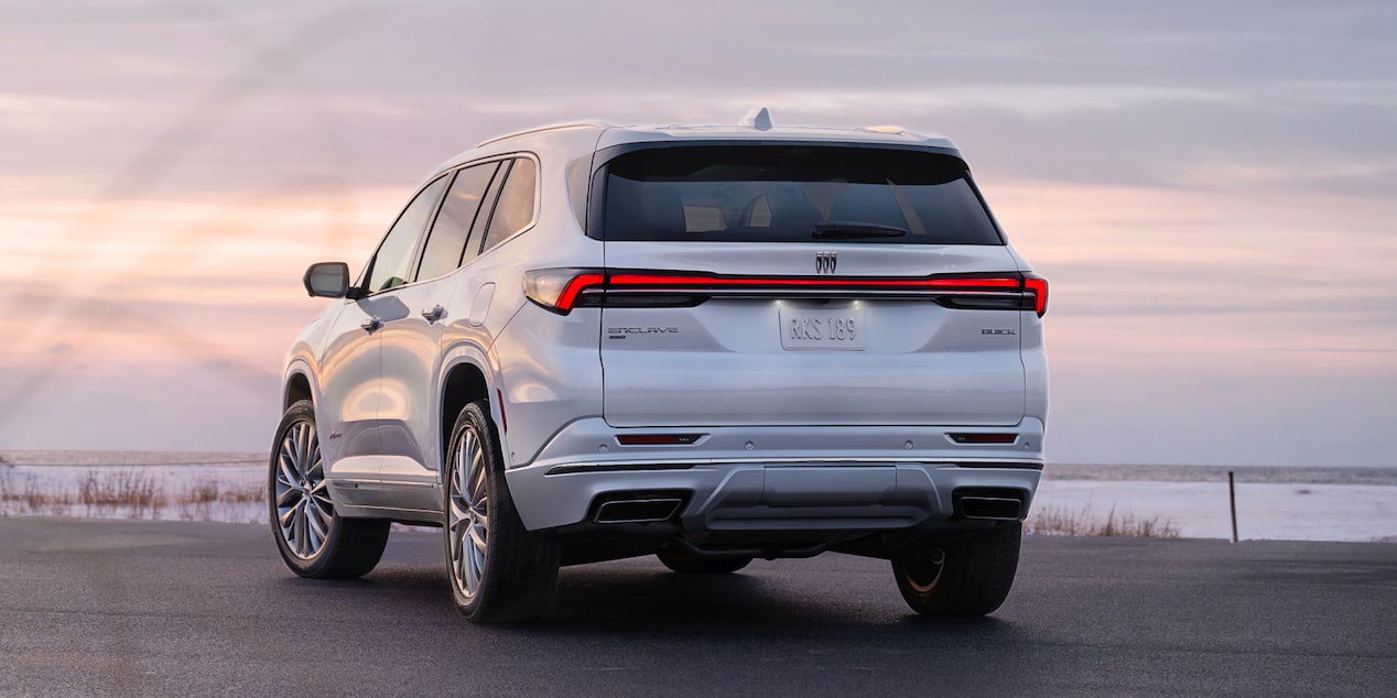 Back-side view of the 2025 Buick Enclave parked alone during sunset.